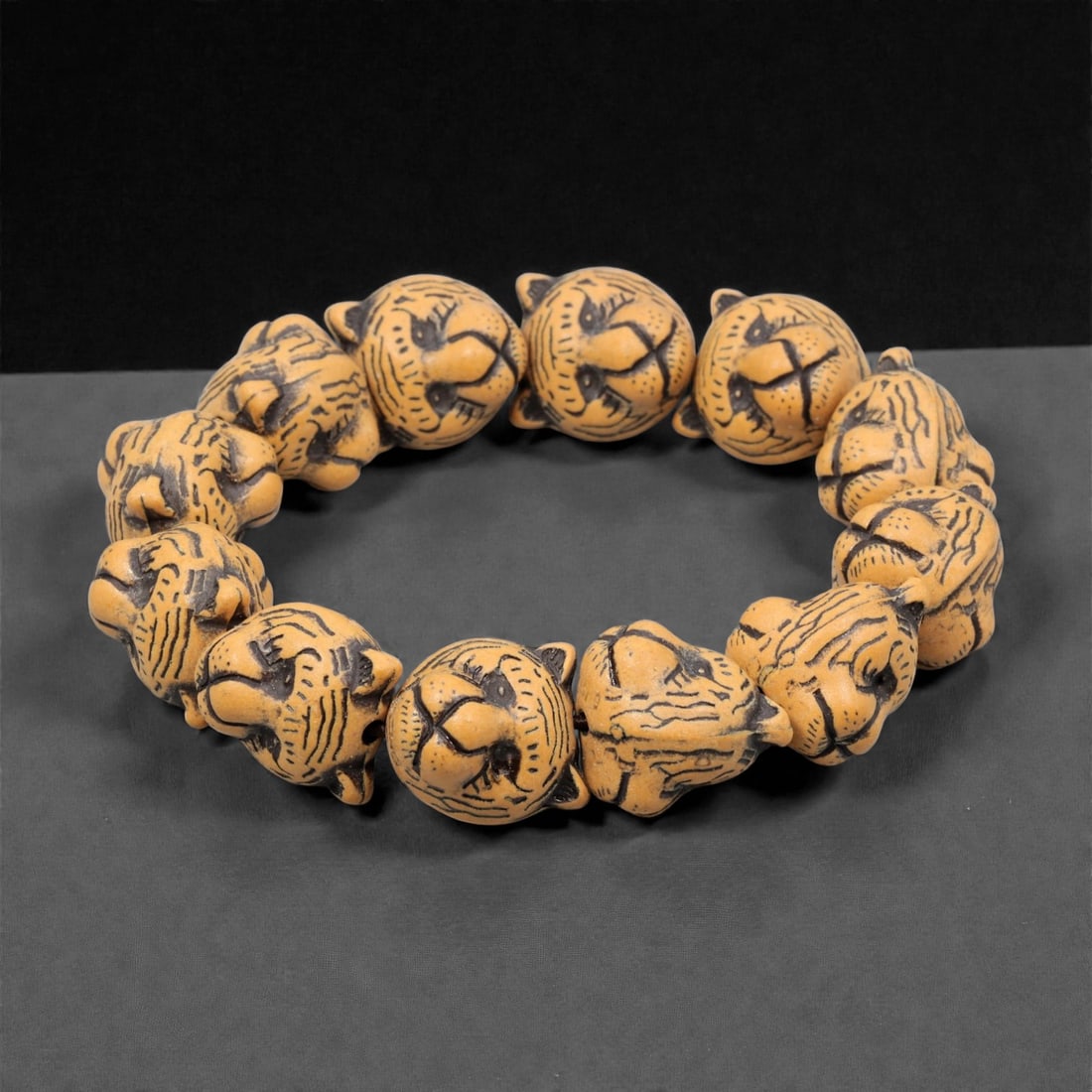 A Chinese Composite Wood Tiger-Head Bead Bracelet, 20th Century, 57YC (1 of 2)