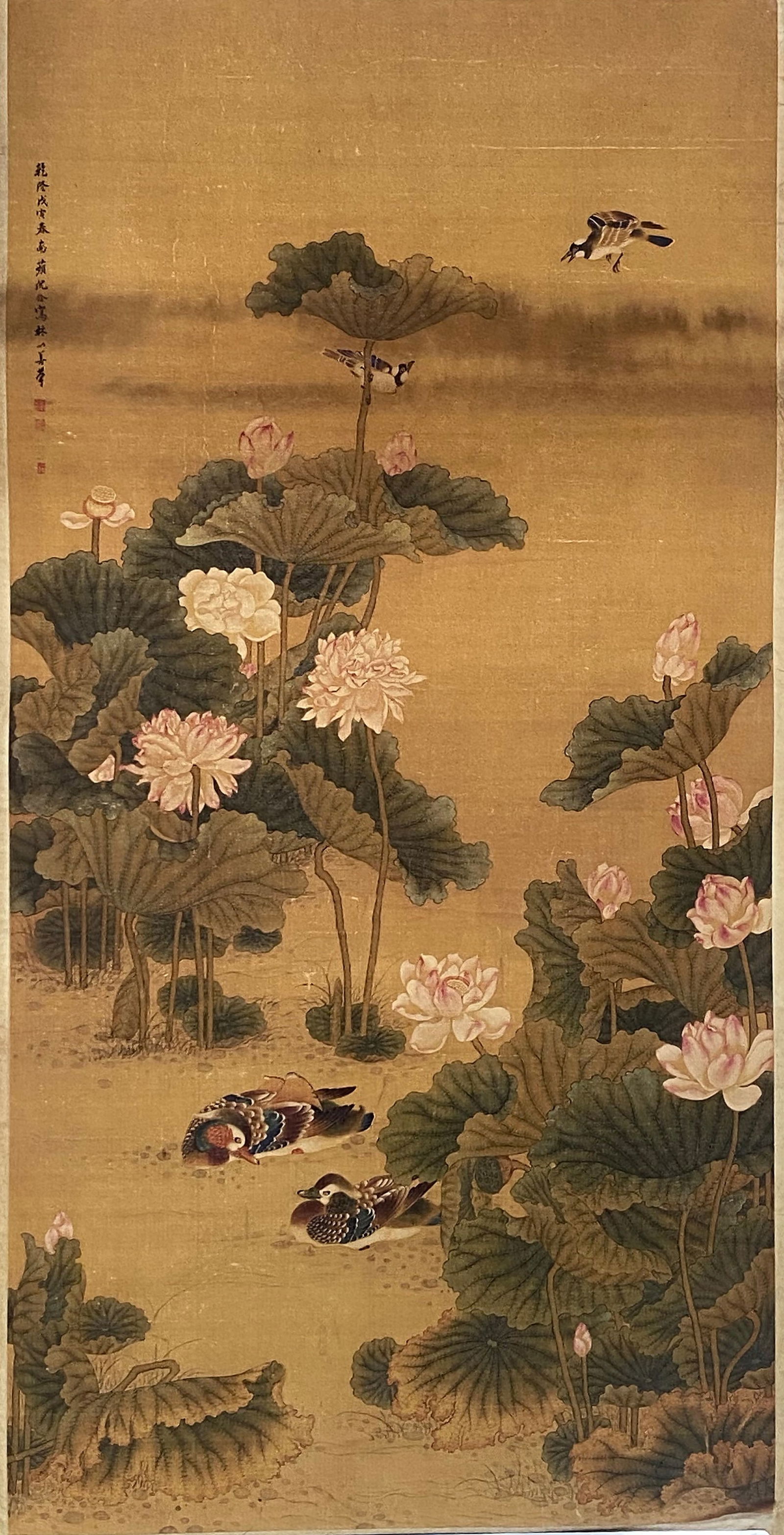 A Chinese Ink and Color Art Print of Lotus Pond with Mandarin Ducks, 20th Century, 12FK: Produced using fine art printing processes on aged paper stock, the work is an ink and color art print executed in the traditional Chinese bird-and-flower painting idiom. The composition features a de