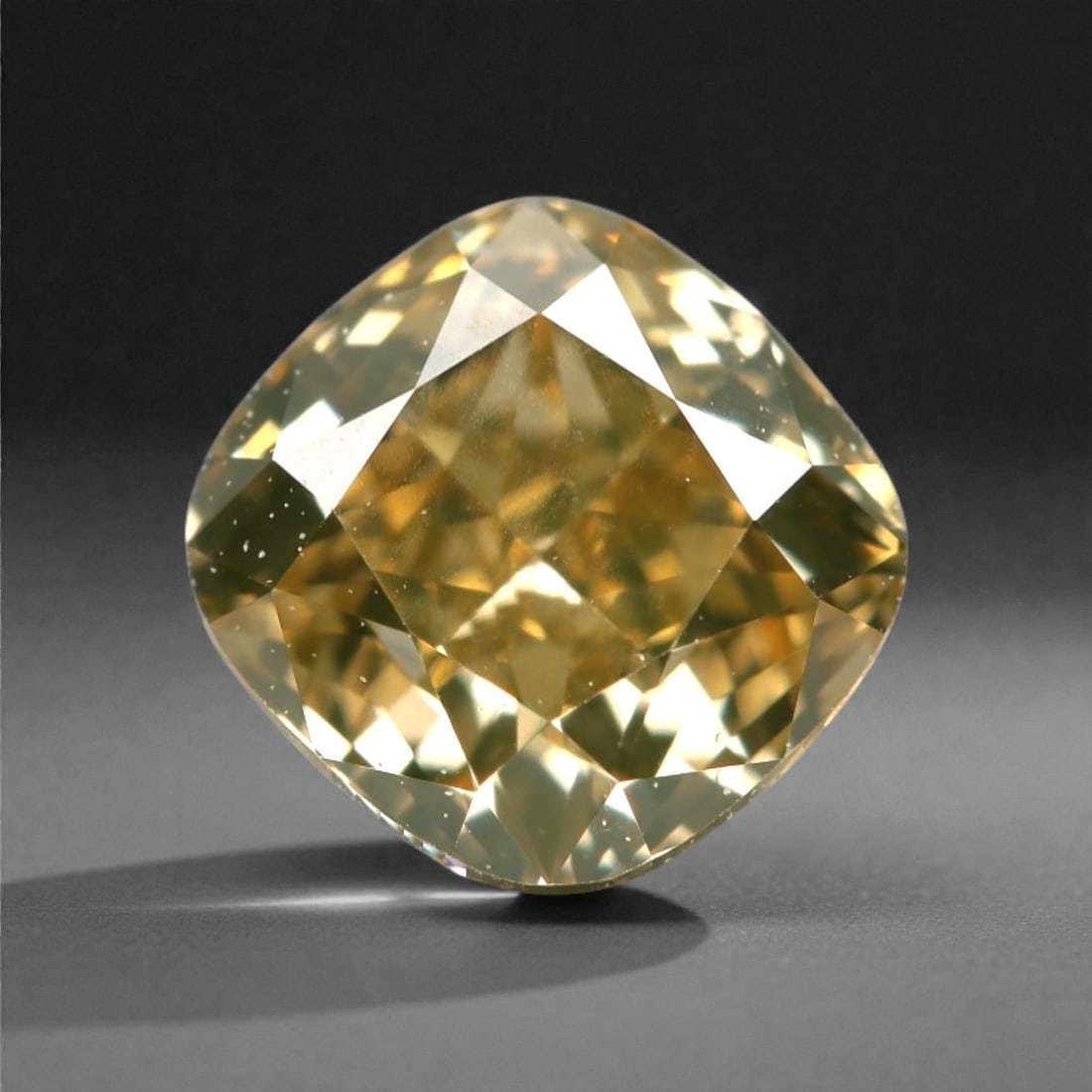 0.76 Carats Fancy Light Yellow Diamond - Natural South African Origin, 11DA: This 0.76 carat fancy light yellow diamond glows with a soft, buttery hue reminiscent of sun-warmed honey, its cushion modified brilliant cut amplifying a luminous, lively sparkle across every precise
