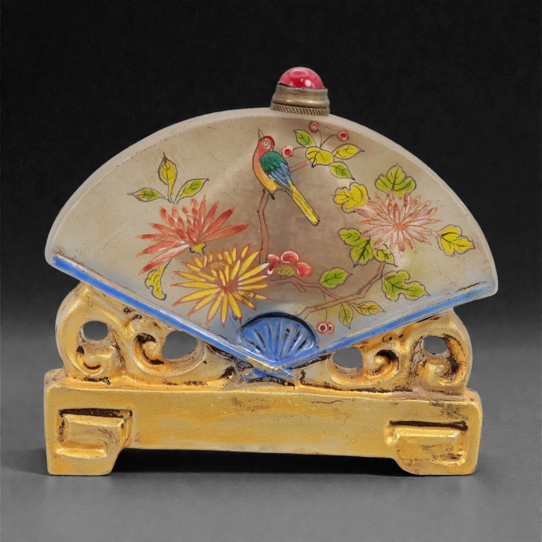 A Chinese Painted Glass Folding Fan Snuff Bottle, Qing Dynasty, Qianlong Period, 36FG: The snuff bottle is formed from glass and modeled as an open folding fan mounted on an integral stand, with a small circular mouth set at the upper edge and fitted with a metal-mounted collar. The fan