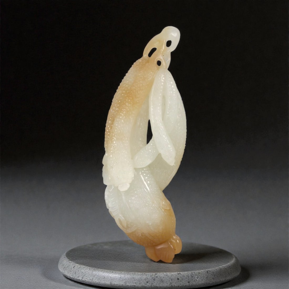 A Chinese Nephrite Jade Plant-Form Openwork Carving, 20th Century, 13FC: Carved from pale green to honey-toned nephrite jade with areas of translucency and natural color variation, the object is modeled as a stylized plant form rendered in openwork. The elongated vertical