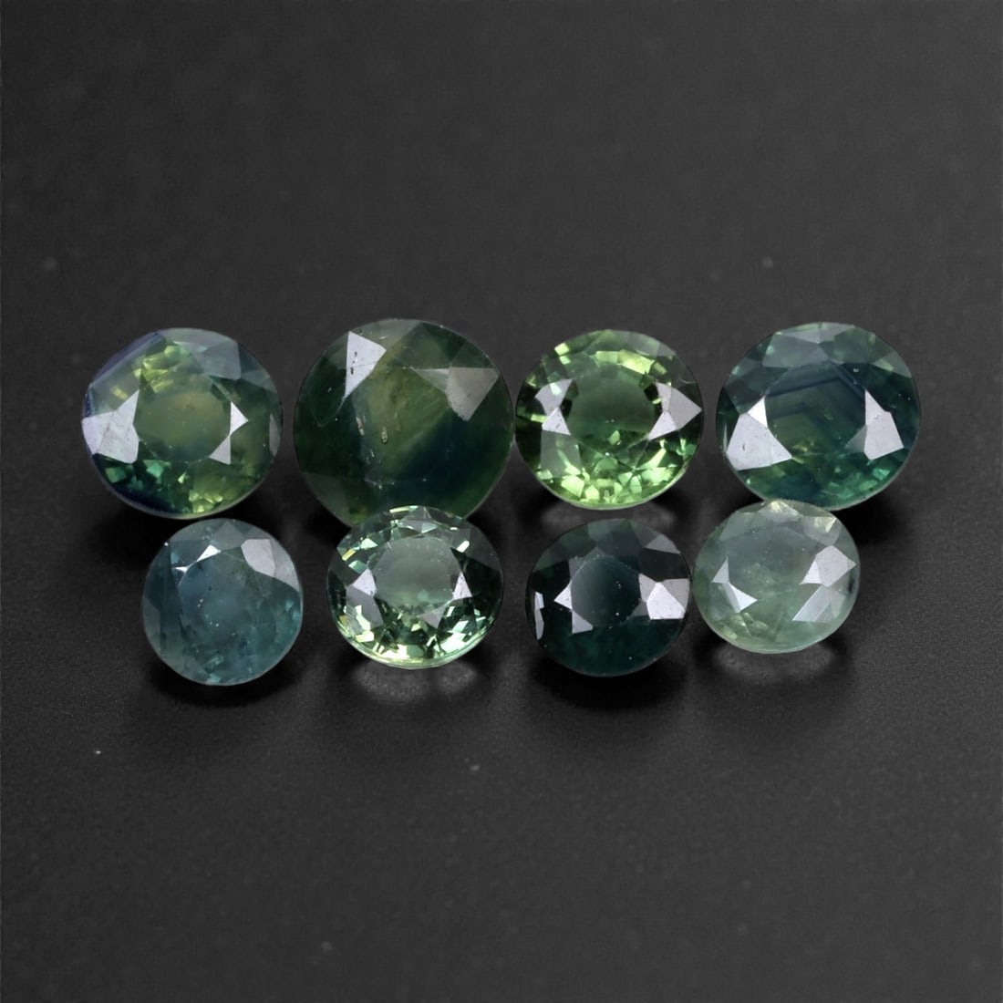 5.04 Carats Green-Blue Sapphire Parcel - Natural Madagascar Stones, 5.8x3.7mm, 100XH: This moody and alluring parcel of sapphires features a blend of forest green, teal, and inky blue tones, each stone shifting subtly in hue as light moves across their surfaces. The mixed saturation an