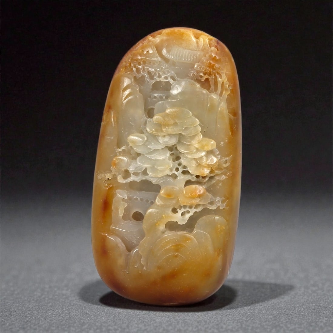 A Chinese Hetian Nephrite Jade Landscape Plaque, Qing Dynasty, 18th-19th Century, 33YB: Carved from pale white Hetian nephrite with extensive russet-brown skin retained along the outer edges, the plaque is worked in an elongated rectangular form with rounded corners. One face is carved i