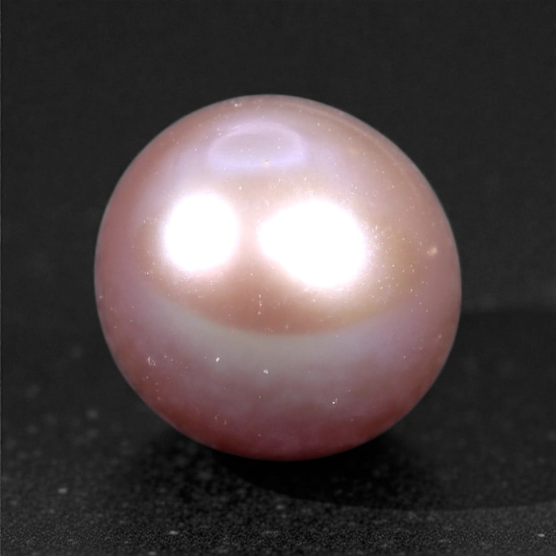 3.06 Carats Blush Pink Cultured Pearl - Natural Freshwater Gem, 45XC: This elegant cultured pearl glows with a delicate blush pink hue, beautifully enhanced by luminous lavender and cream overtones. At 7.5mm, it is well-proportioned and gracefully round, with a soft shi
