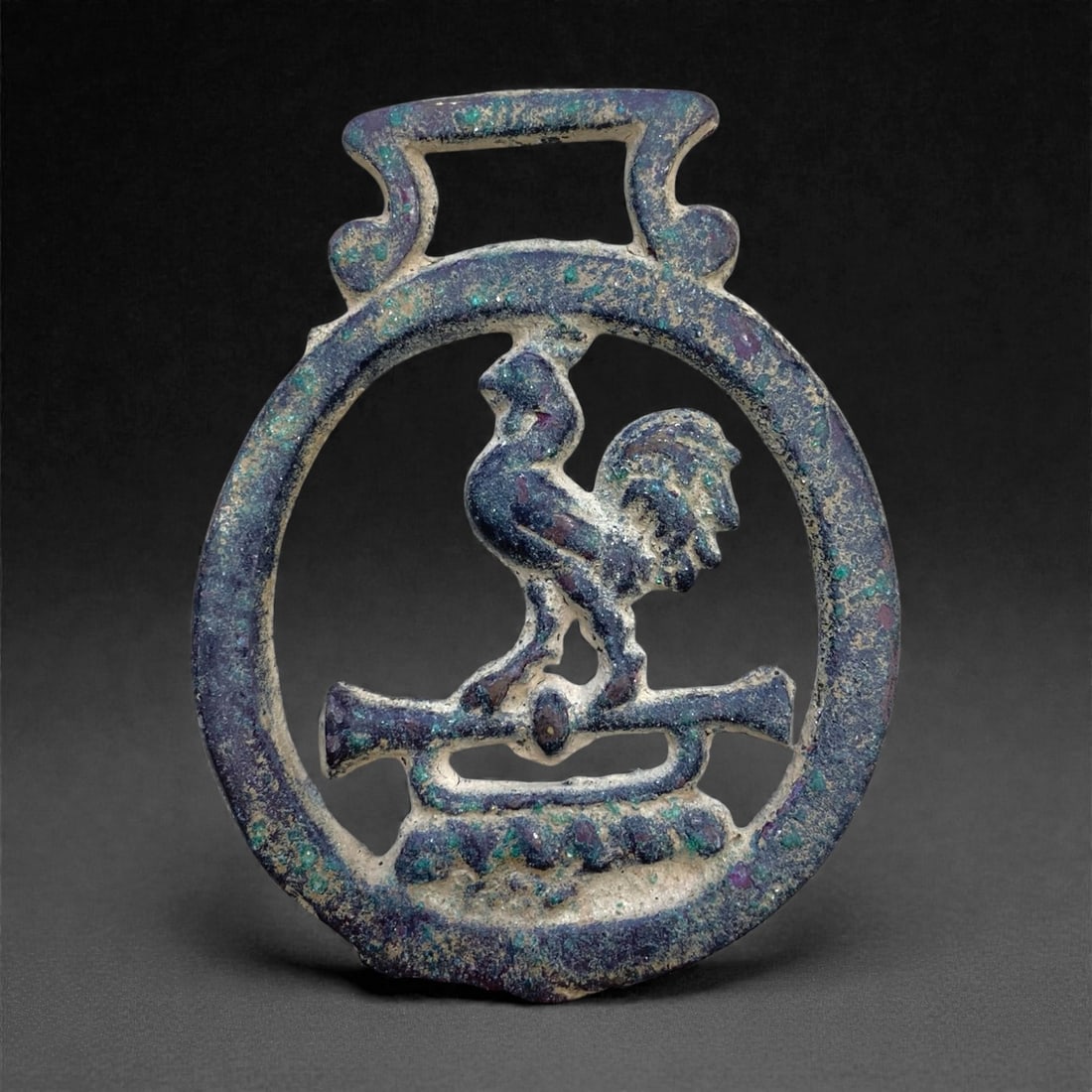 An Ancient Roman Bronze Plaque, 65g, 89AA: Cast in solid bronze with an integral raised border defining a rectangular form, the plaque features low-relief figural decoration across its face, rendered in the characteristic stylistic vocabulary