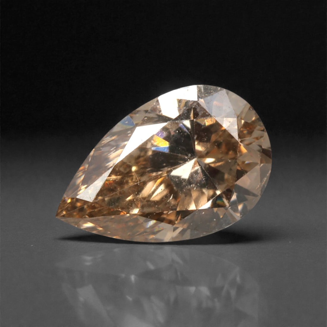 0.38 Carats Fancy Light Brownish Pink Diamond - Natural South African Origin, 33DA: This 0.38 carat fancy light brownish pink diamond captivates with a delicate, peachy-pink hue infused with warm, champagne undertones, creating a soft, romantic glow that is both understated and allur