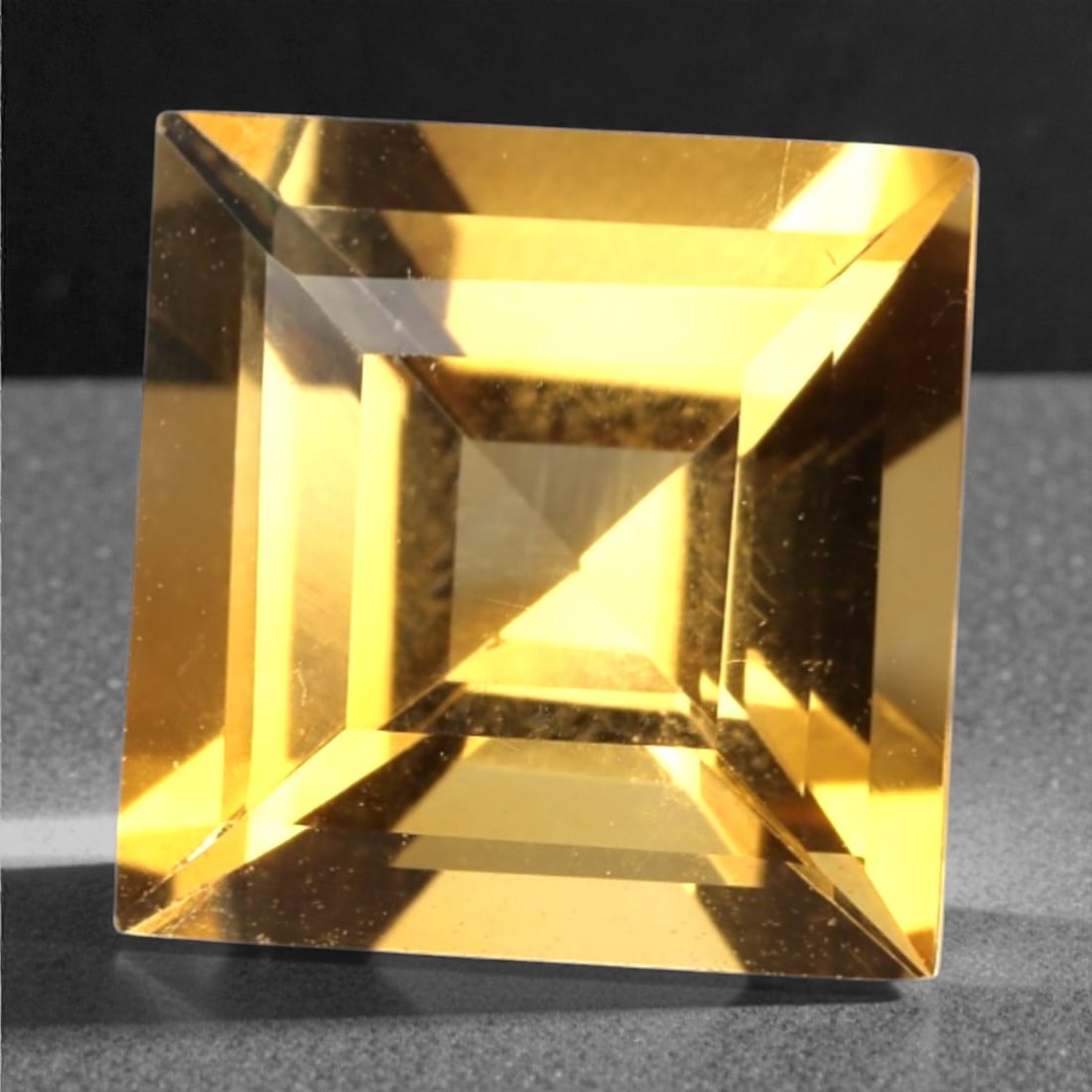 2.80 Carats Golden Yellow Citrine - Natural Brazilian Stone, 382A: This exceptional square-cut citrine gemstone captivates with a rich, honeyed golden-yellow hue, reminiscent of sunlit amber and liquid gold. The precision faceting maximizes light dispersion, creating