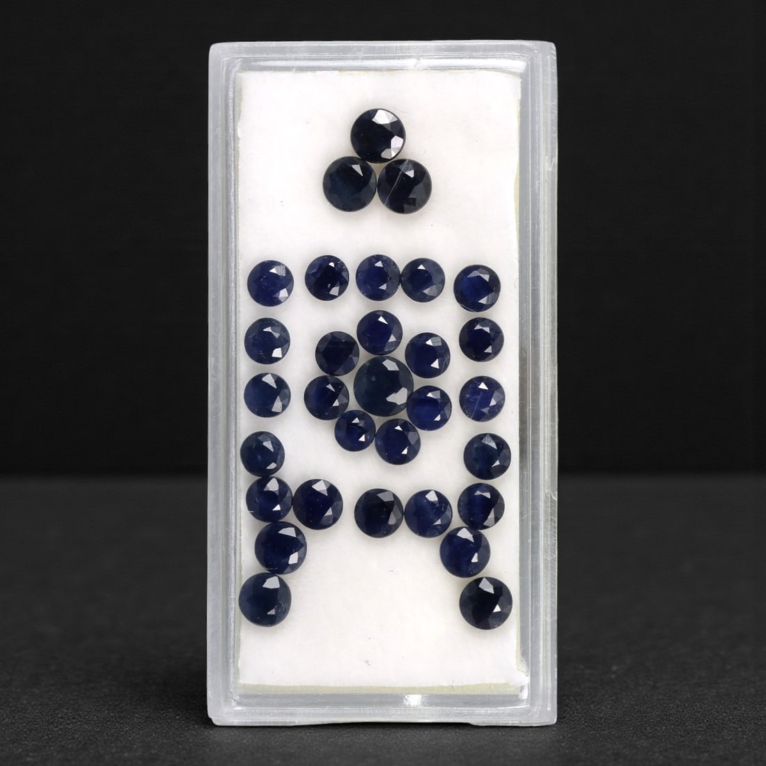 7.28 Carats Australian Blue Sapphire Parcel - Round Brilliant Cut, 63DA: This curated parcel of round brilliant-cut blue sapphires from Australia exhibits a rich, deep blue hue, reminiscent of the ocean at midnight. Each stone is precision-cut to maximize light return, cre