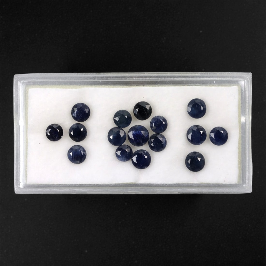 5.43 Carats Australian Blue Sapphire Parcel - Round Brilliant Cut, 68DA: This curated parcel of round brilliant-cut blue sapphires from Australia exhibits a rich, deep blue hue, reminiscent of the ocean at midnight. Each stone is precision-cut to maximize light return, cre