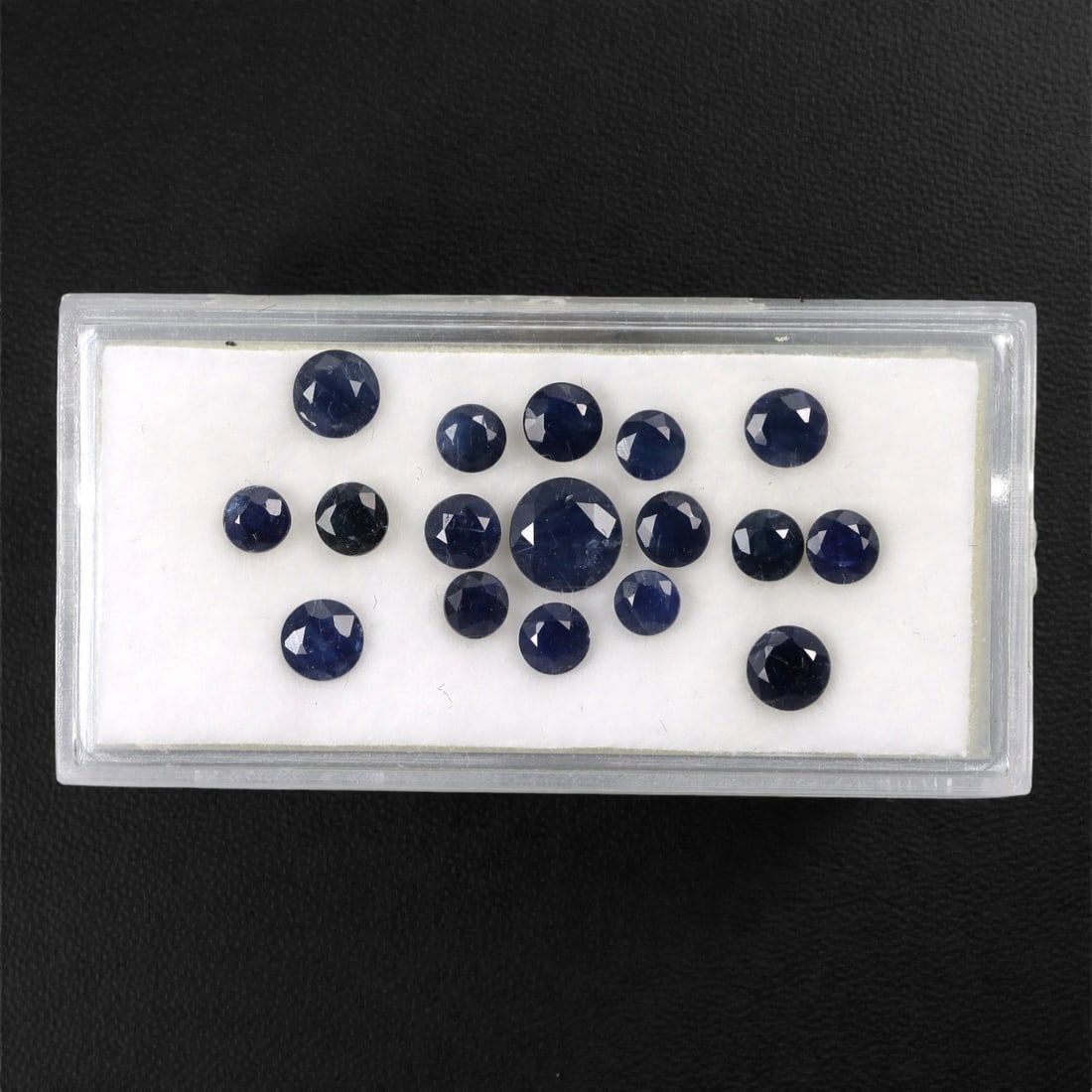 5.61 Carats Australian Blue Sapphire Parcel - Round Brilliant Cut, 56DA: This curated parcel of round brilliant-cut blue sapphires from Australia exhibits a rich, deep blue hue, reminiscent of the ocean at midnight. Each stone is precision-cut to maximize light return, cre