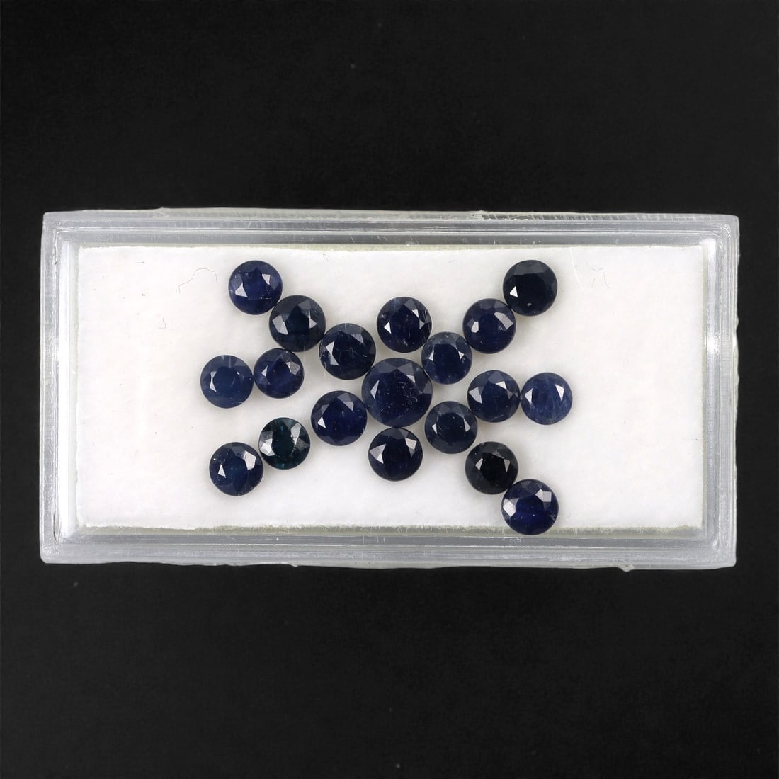 6.56 Carats Australian Blue Sapphire Parcel - Round Brilliant Cut, 58DA: This curated parcel of round brilliant-cut blue sapphires from Australia exhibits a rich, deep blue hue, reminiscent of the ocean at midnight. Each stone is precision-cut to maximize light return, cre