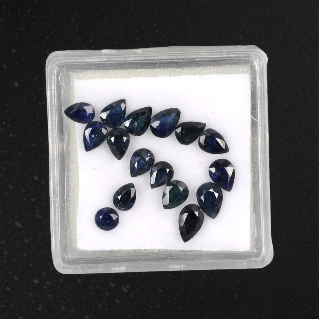 3.36 Carats Australian Blue Sapphire Parcel - Pear & Round Cut, 96DA: This curated parcel of pear and round-cut blue sapphires from Australia exhibits a rich, deep blue hue, reminiscent of the ocean at midnight. Each stone is precision-cut to maximize light return, crea