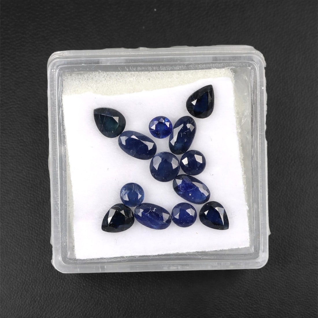 3.59 Carats Australian Blue Sapphire Parcel - Mixed Cut, 92DA: This curated parcel of mixed-cut blue sapphires from Australia exhibits a rich, deep blue hue, reminiscent of the ocean at midnight. The stones are precision-cut in a variety of shapes, including oval
