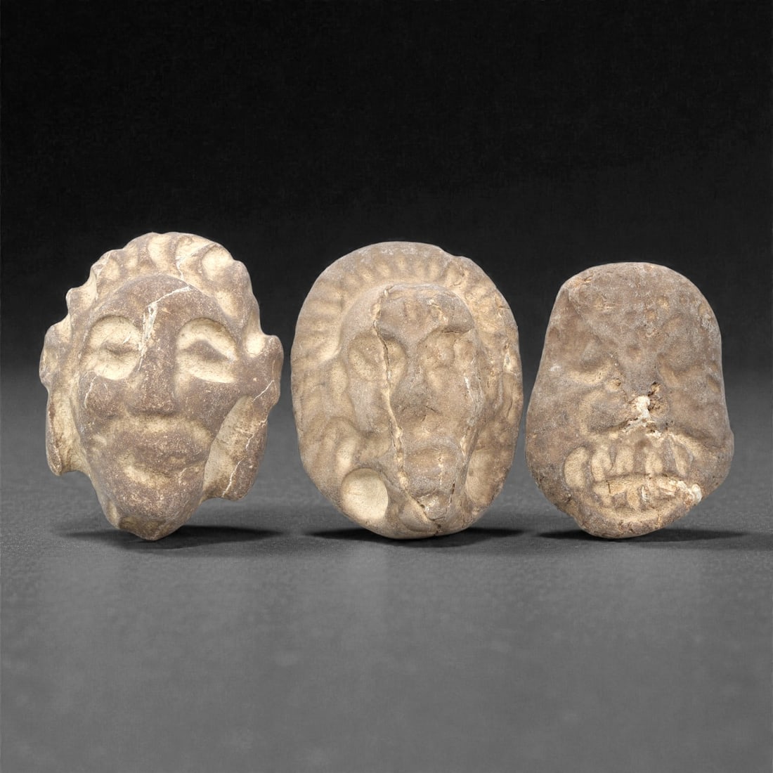 A Group of Three Ancient Near Eastern Stone Maskettes, 2nd-1st Millennium BCE, 100ZG (1 of 1)