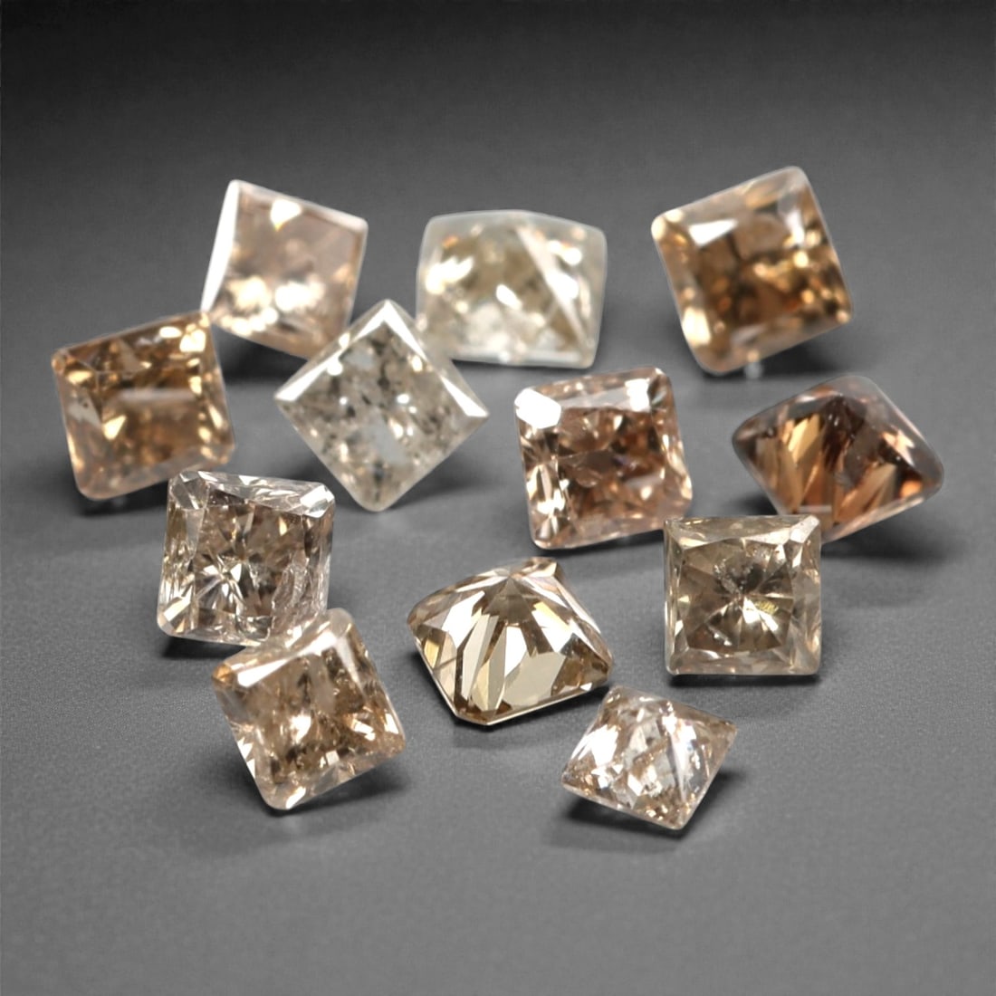 0.52ct 12 Pieces Champagne Diamond Parcel - Princess Cut, 208A: This elegant parcel of 12 loose champagne diamond gems captivates with a warm, honeyed hue that evokes the richness of aged champagne and the glow of liquid sunlight. Each stone is cut in a well-propo