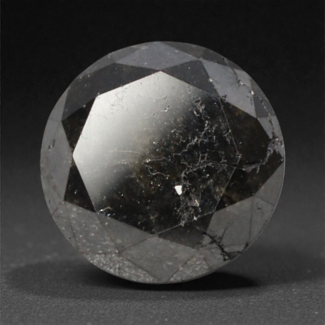 1.41 Carats Black Diamond - Round Brilliant Cut, 299A: This substantial black diamond captivates with a deep, opaque black hue that evokes the intensity of polished obsidian and the mystery of a midnight sky. Cut in a well-proportioned round brilliant sha