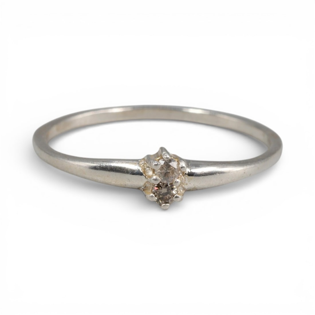 Sterling Silver (925) Ring with Two Champagne Diamonds - Size 6 US, 124A: This delicate ring is crafted from polished sterling silver, featuring a slender, tapered band that culminates in a dual-stone setting. The design centers on two small, round-cut champagne diamonds, h