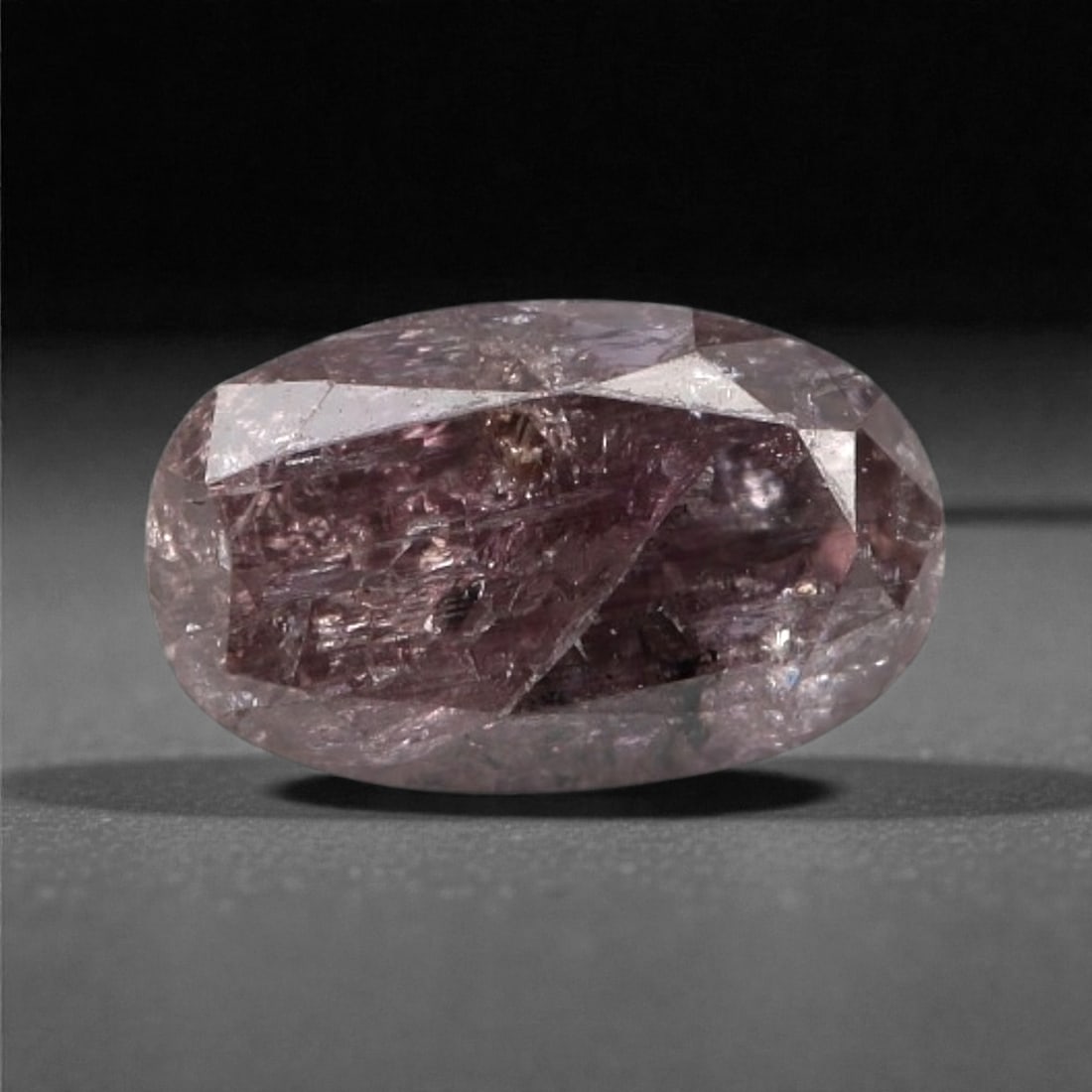0.25 Carats Purplish Pink Diamond - Natural Argyle Mine, Australia, 82A: This singular purplish pink diamond from the Argyle mine is a rare and captivating gem, showcasing the distinctive, velvety hue that has made Australian pink diamonds among the most coveted in the wor