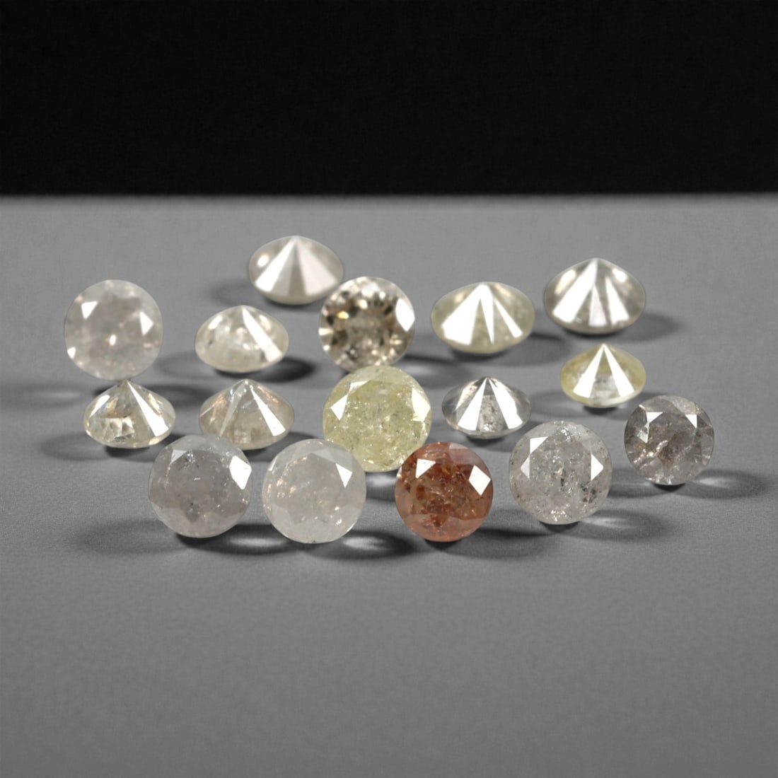 1.02 Carats Fancy Yellow Diamond Parcel - Natural African Stones, 49A: This exquisite parcel of round fancy diamonds radiates with a warm, honeyed glow, ranging from soft lemon and buttercup hues to deeper golden amber tones. Each stone is precision-cut to maximize light