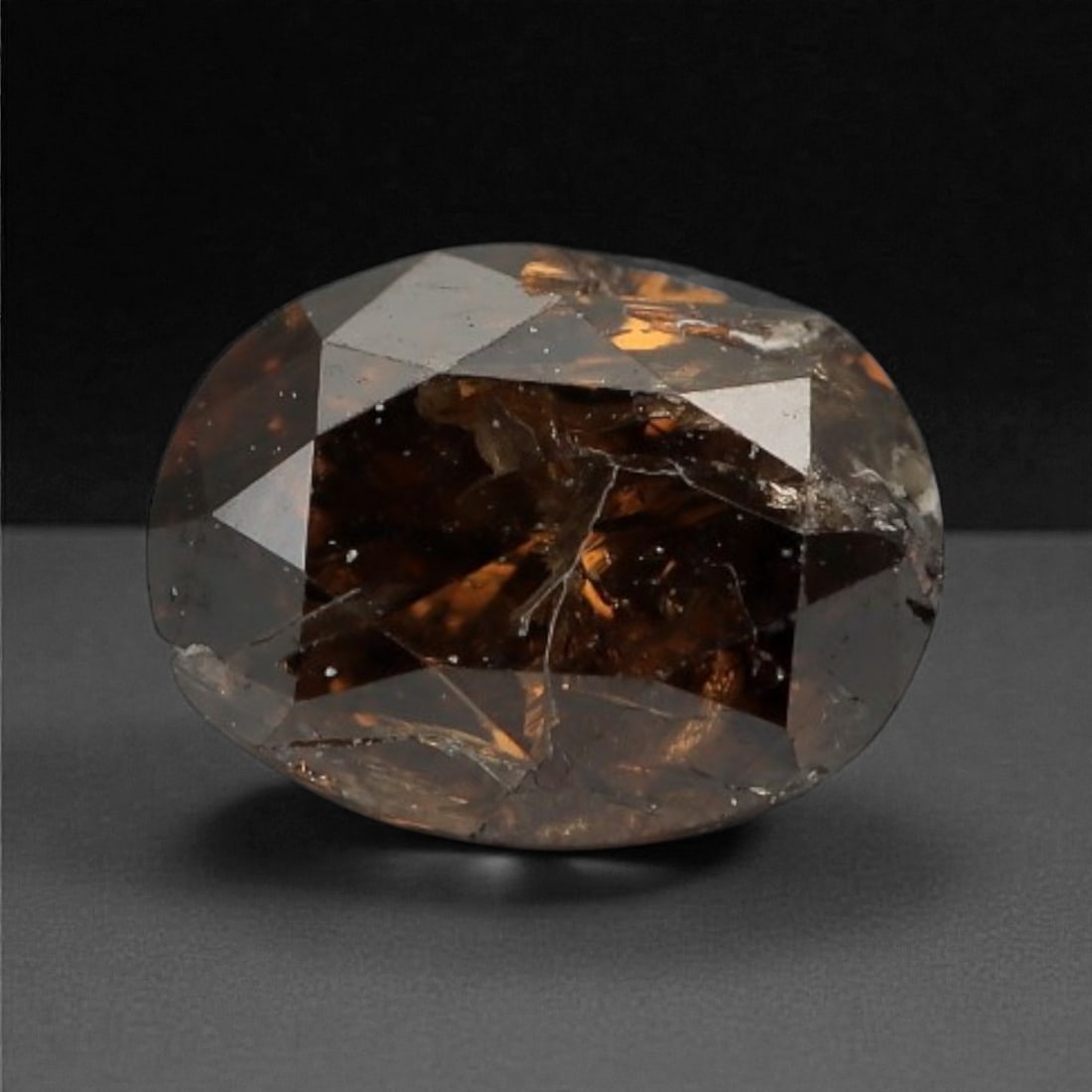 0.20 Carats Cognac Fancy Diamond - Natural African Stone, 4x3.1mm, 28A: This singular cognac fancy diamond radiates with a warm, ambered glow, evoking the rich tones of aged brandy and sunlit honey. Precision-cut in a classic brilliant shape, its facets catch light to rev