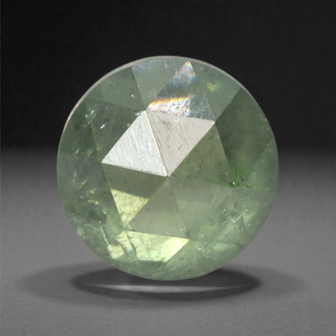 0.24 Carats Fancy Green Rose Cut Diamond - Natural Loose Gemstone, 47DA: This 0.24 carat rose cut diamond captivates with a soft, luminous fancy green hue that radiates gentle vibrancy from its distinctive flat, faceted surface. The classic rose cut, with its symmetrical a