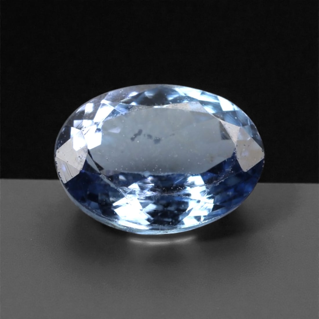 1.10 Carats Violet Blue Tanzanian Tanzanite Oval Cut - 7.3 x 5.6 x 3.4 mm, 58XK: This charming tanzanite displays a bright violet blue hue with lively flashes of cool blue and soft lavender as it catches the light. The oval cut provides a balanced face-up appearance, enhancing bri