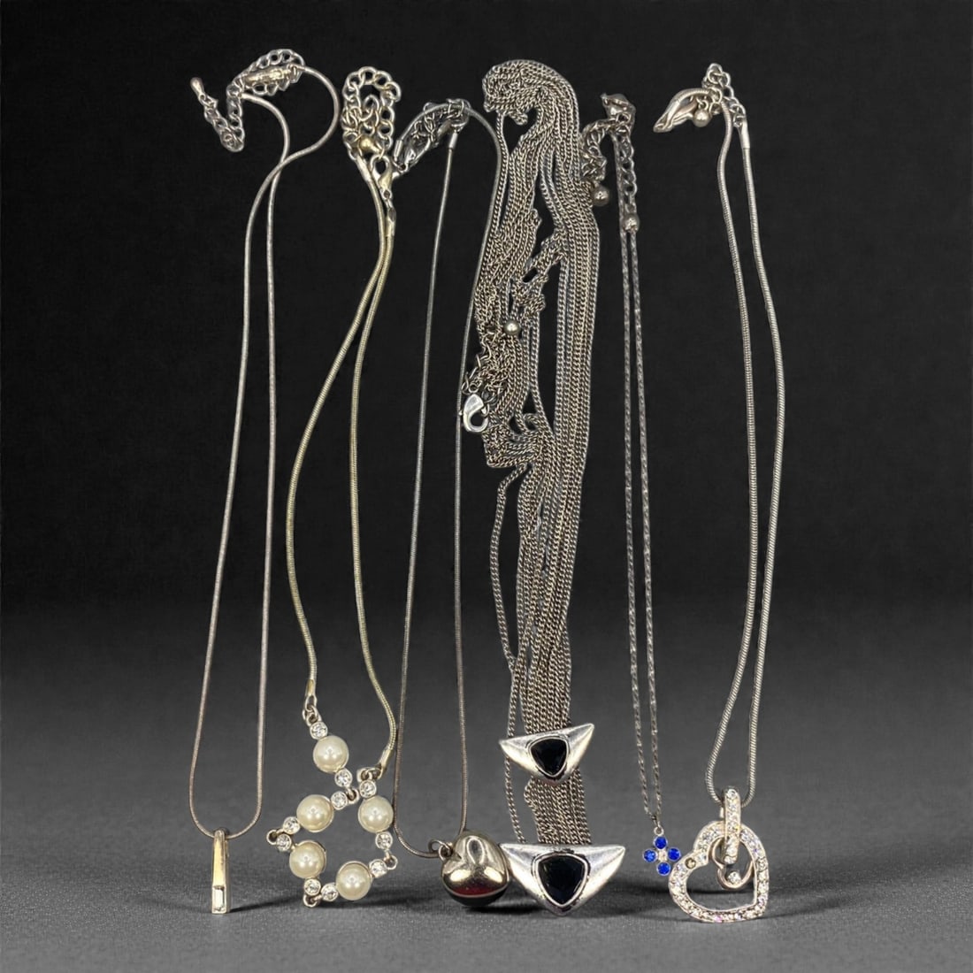 An Estate Lot of Six Silver-Toned Necklaces, Late 20th Century, 67FK (1 of 1)