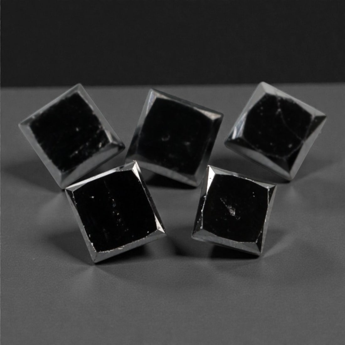 0.98 Carats Black Diamond Parcel - Princess Cut, 240A: This striking parcel of five loose black diamond gems captivates with a deep, opaque black hue that evokes the intensity of polished obsidian and the mystery of a midnight sky. Each stone is cut in a