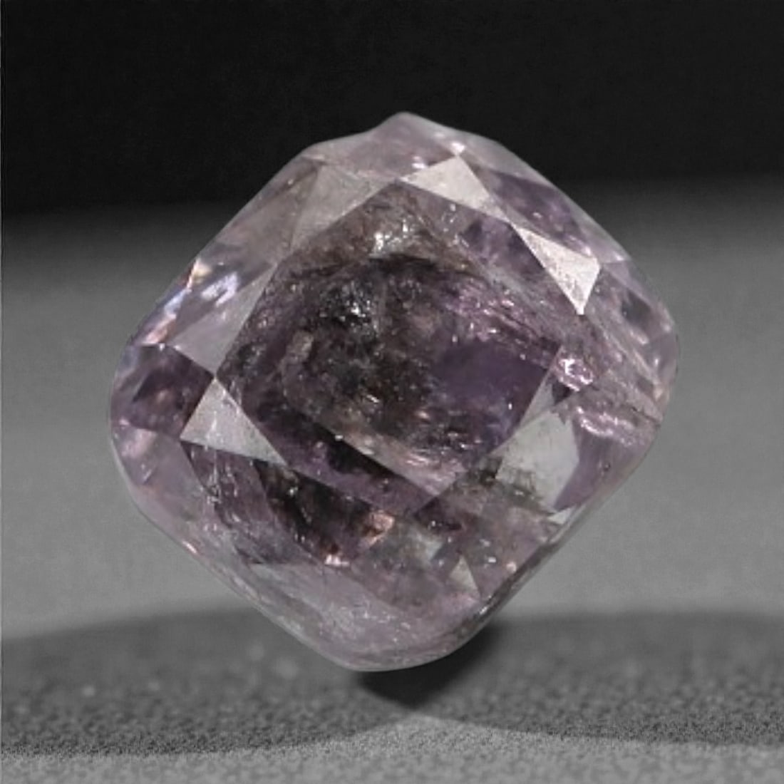 0.14 Carats Purplish Pink Diamond - Natural Argyle Mine, Australia, 84A: This singular purplish pink diamond from the Argyle mine is a rare and captivating gem, showcasing the distinctive, velvety hue that has made Australian pink diamonds among the most coveted in the wor