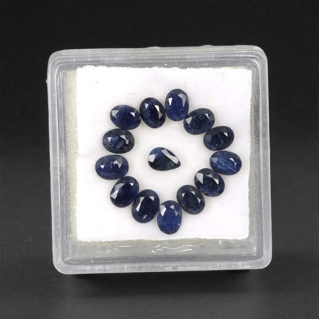 3.51 Carats Australian Blue Sapphire Parcel - Oval & Pear Cut, 90DA: This curated parcel of oval and pear-cut blue sapphires from Australia exhibits a rich, deep blue hue, reminiscent of the ocean at midnight. Each stone is precision-cut to maximize light return, creat