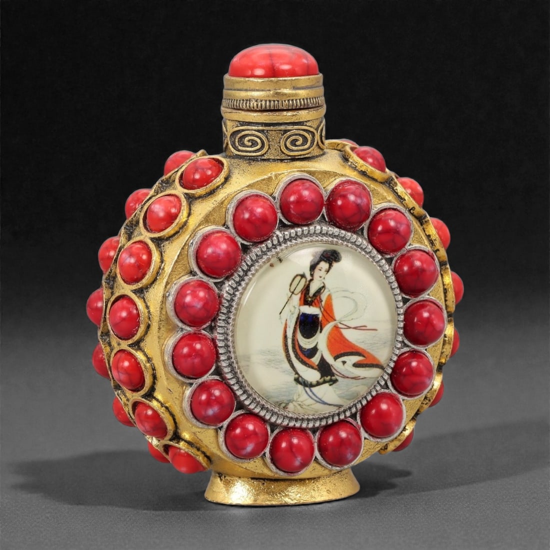 A Chinese Copper-Alloy and Beaded Snuff Bottle, 20th Century, 26FG: Constructed in copper alloy or brass, the snuff bottle is formed with a flattened circular body set on a short foot ring and rising to a cylindrical neck fitted with a domed stopper. The surface is de