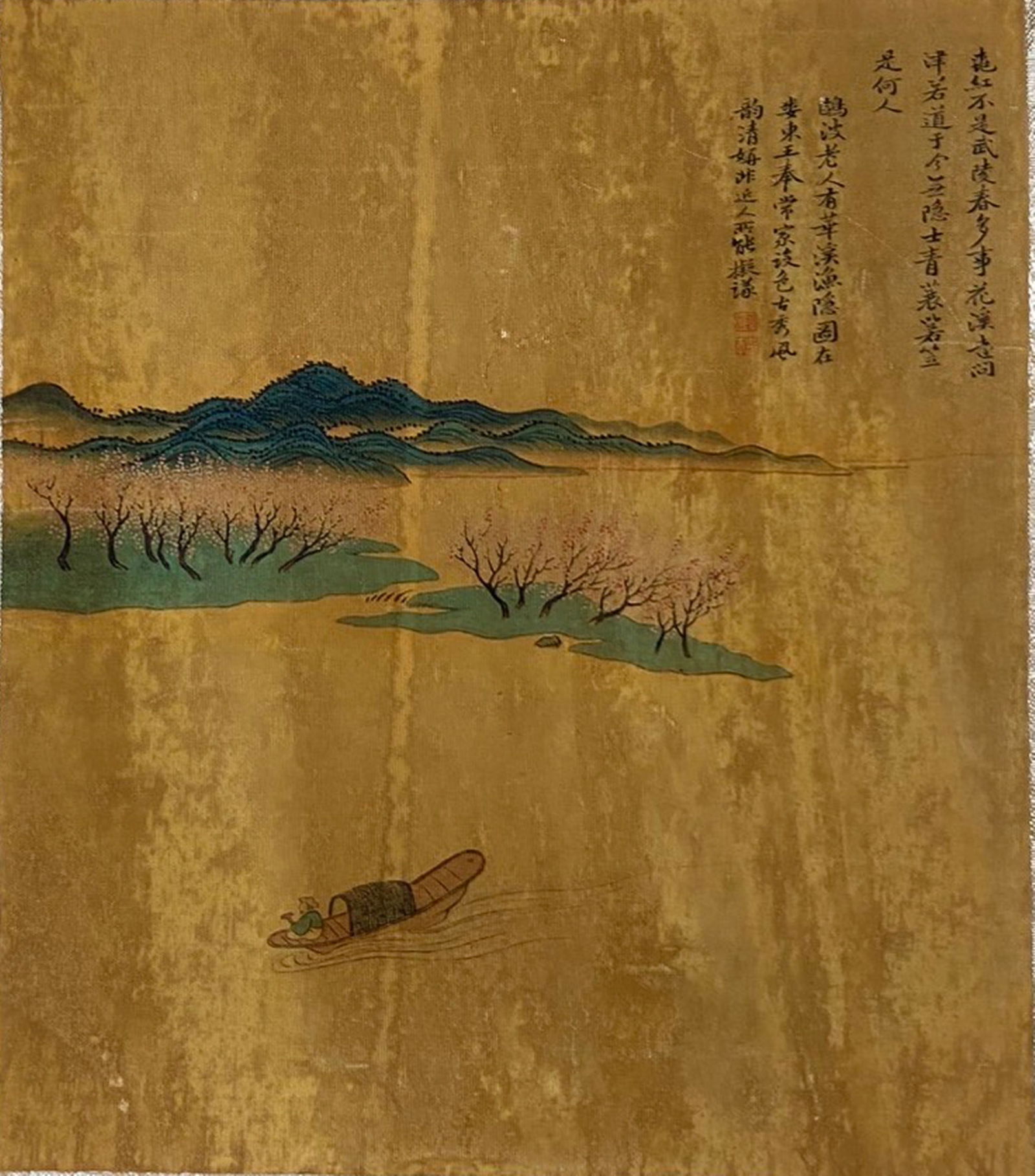 A Chinese Ink and Color Textile Print, Peach Blossom Spring, 20th Century, 28FK: Printed on woven silk or hemp textile with a gold-toned ground, the composition depicts the idyllic scene of Peach Blossom Spring, inspired by the classic Chinese fable. A solitary fisherman drifts in