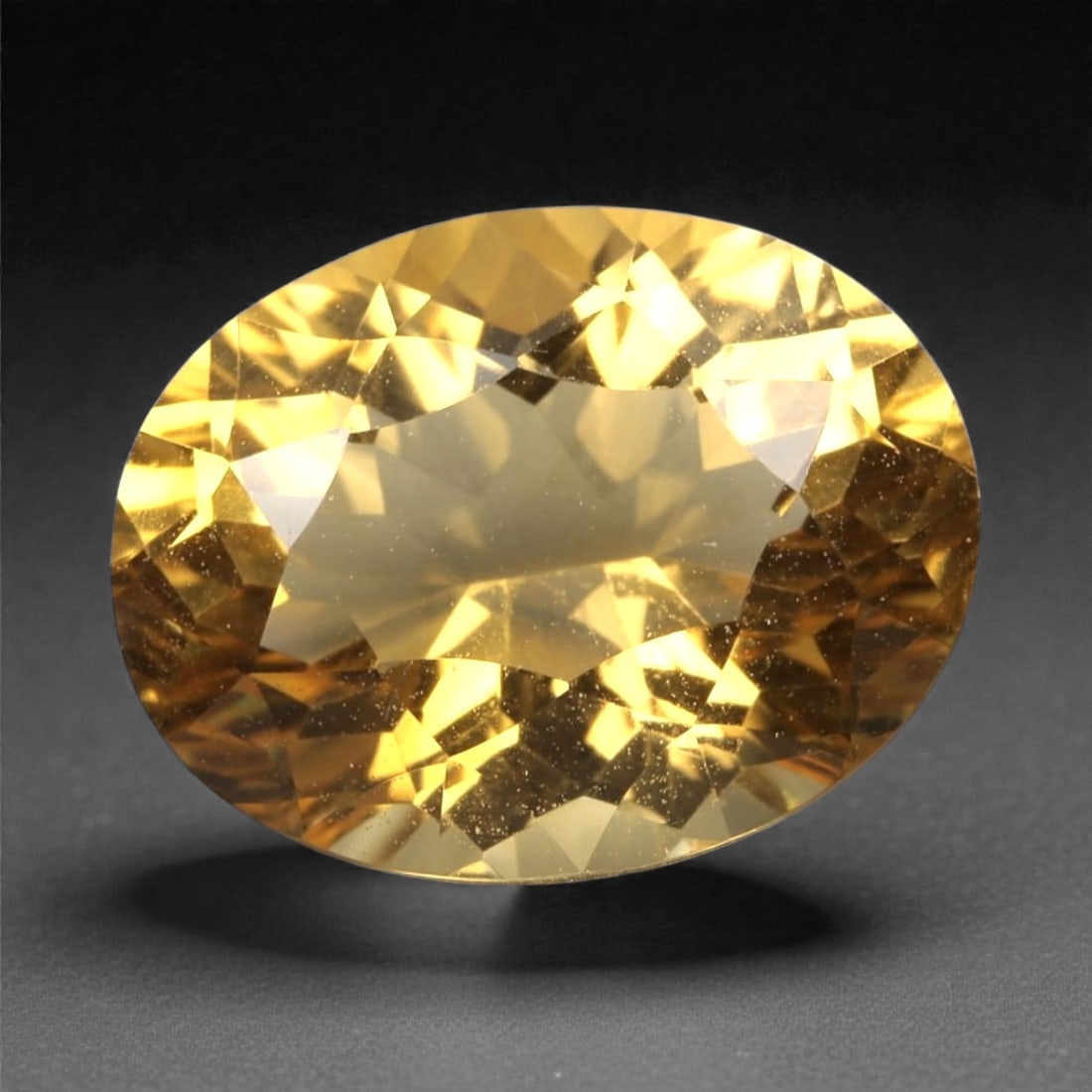 3.76 Carats Golden Yellow Citrine - Natural Brazilian Stone, 372A: This exceptional oval-cut citrine gemstone captivates with a rich, honeyed golden-yellow hue, reminiscent of sunlit amber and liquid gold. The precision faceting maximizes light dispersion, creating a