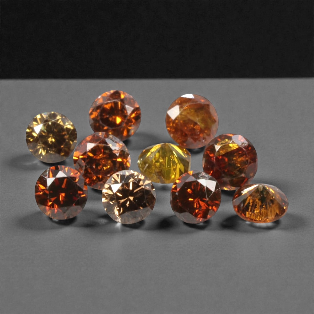 10 Pieces Irradiated Red Diamond Parcel - Round Brilliant Cut, 1.6-1.7mm, 274A: This vibrant parcel of 10 loose irradiated red diamond gems captivates with a rich, fiery red hue that evokes the intensity of a glowing ember and the warmth of a sunset. Each stone is cut in a well-p