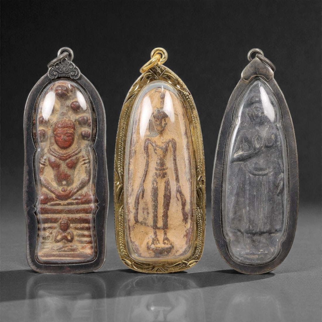 A Group of Three Thai Terracotta and Metal Amulets, 20th Century, 47FL (1 of 1)