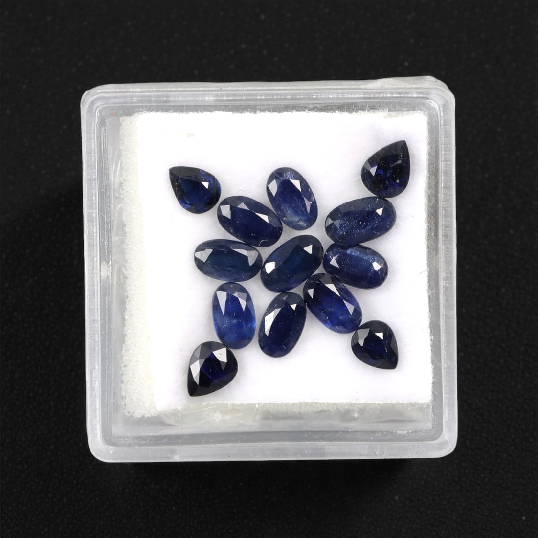 4.31 Carats Australian Blue Sapphire Parcel - Mixed Cut, 87DA: This curated parcel of mixed-cut blue sapphires from Australia exhibits a rich, deep blue hue, reminiscent of the ocean at midnight. The stones are precision-cut in a variety of shapes, including oval