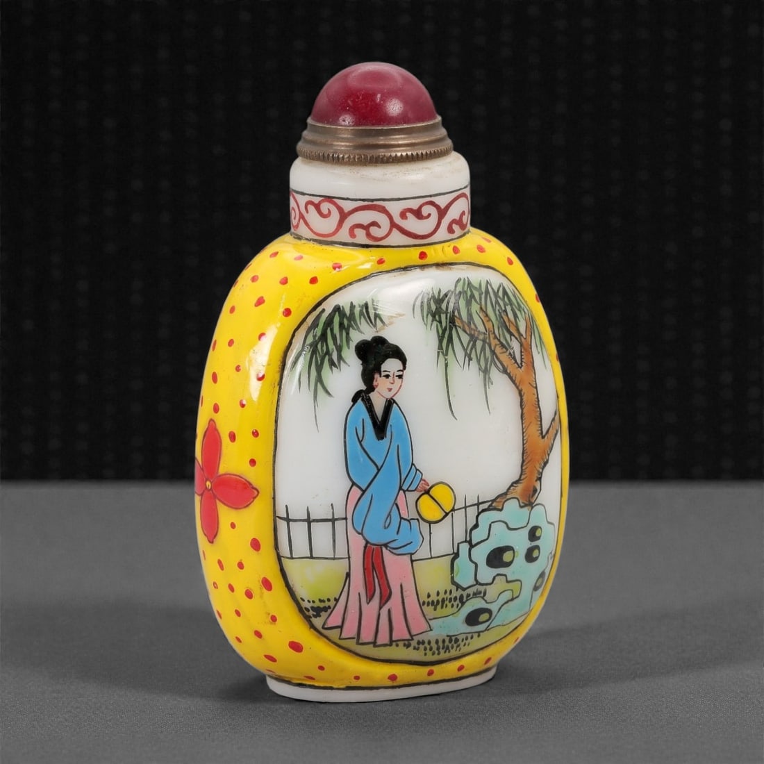 A Chinese Enamelled White Glass Snuff Bottle, Qing Dynasty, Qianlong Period, 21FG: The bottle is formed from opaque white glass of substantial weight, overlaid with brightly colored enamels. The body is coated with a vivid yellow enamel ground, decorated with evenly spaced red dots