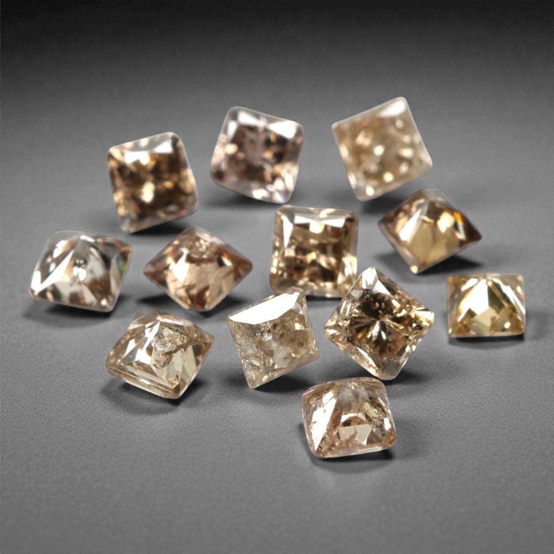0.52ct 12 Pieces Champagne Diamond Parcel - Princess Cut, 206A: This elegant parcel of 12 loose champagne diamond gems captivates with a warm, honeyed hue that evokes the richness of aged champagne and the glow of liquid sunlight. Each stone is cut in a well-propo