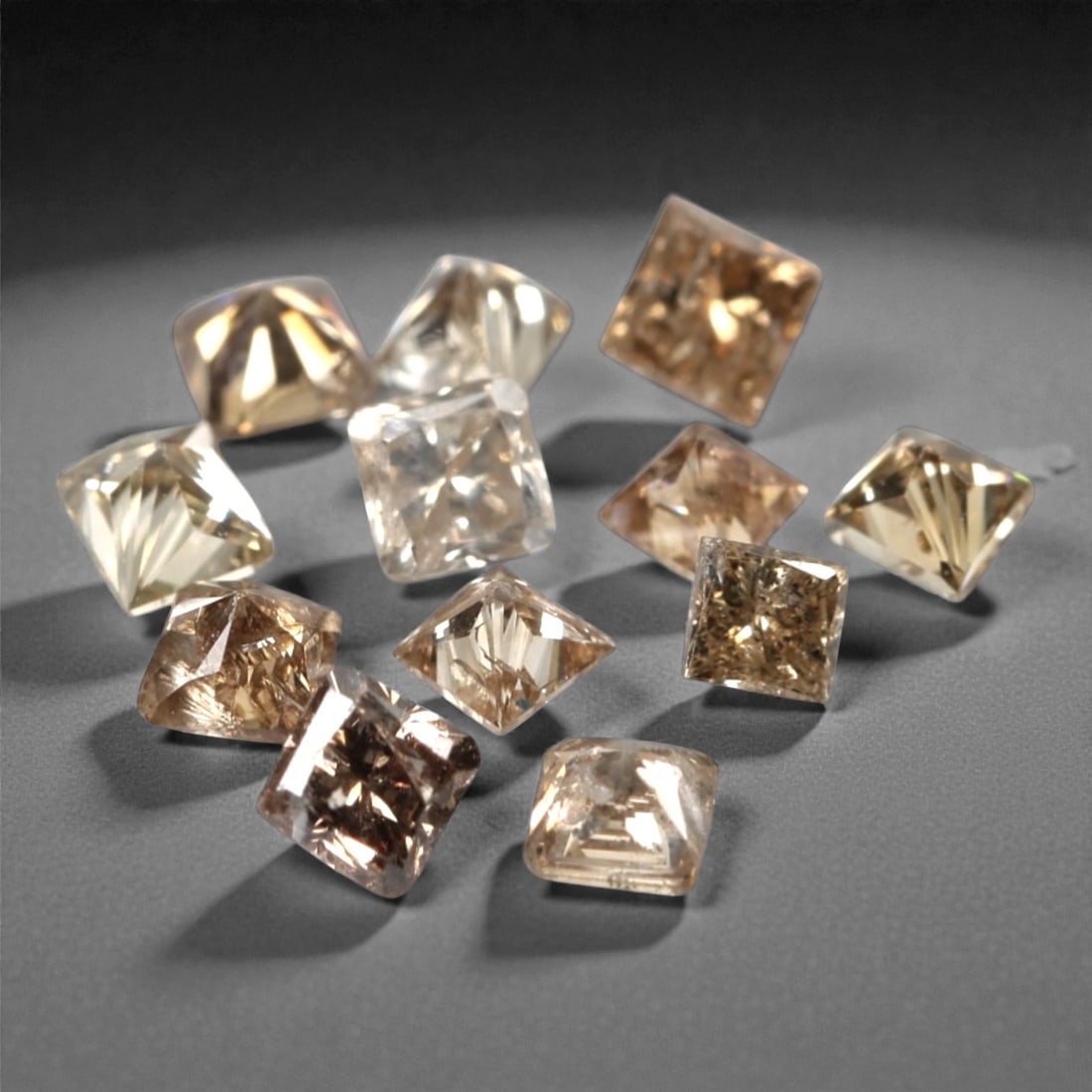 0.50ct 12 Pieces Champagne Diamond Parcel - Princess Cut, 217A: This elegant parcel of 12 loose champagne diamond gems captivates with a warm, honeyed hue that evokes the richness of aged champagne and the glow of liquid sunlight. Each stone is cut in a well-propo