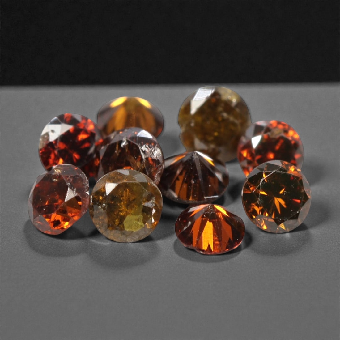 10 Pieces Irradiated Red Diamond Parcel - Round Brilliant Cut, 1.6-1.7mm, 262A: This vibrant parcel of 10 loose irradiated red diamond gems captivates with a rich, fiery red hue that evokes the intensity of a glowing ember and the warmth of a sunset. Each stone is cut in a well-p