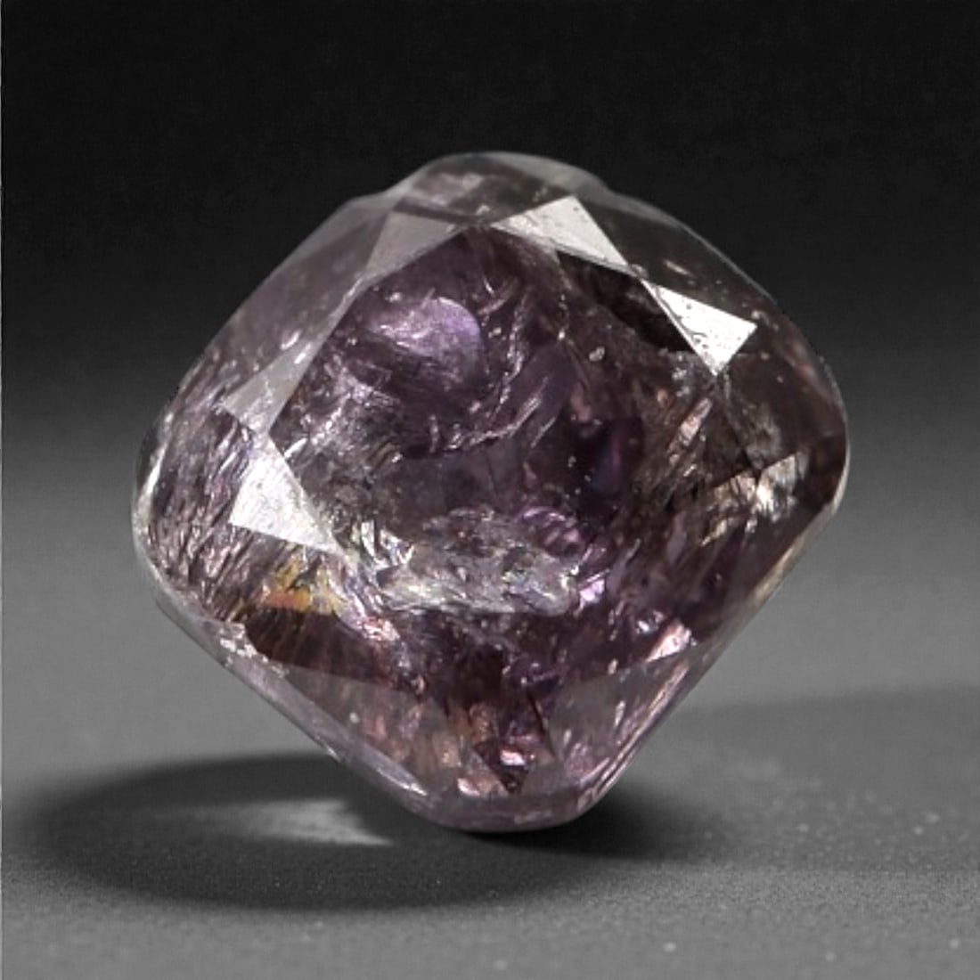 0.20 Carats Purplish Pink Diamond - Natural Argyle Mine, Australia, 96A: This singular purplish pink diamond from the Argyle mine is a rare and captivating gem, showcasing the distinctive, velvety hue that has made Australian pink diamonds among the most coveted in the wor