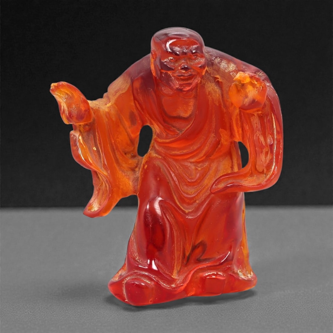 A Chinese Amber-Resin Figure of a Luohan, 20th Century, 42FH (1 of 2)