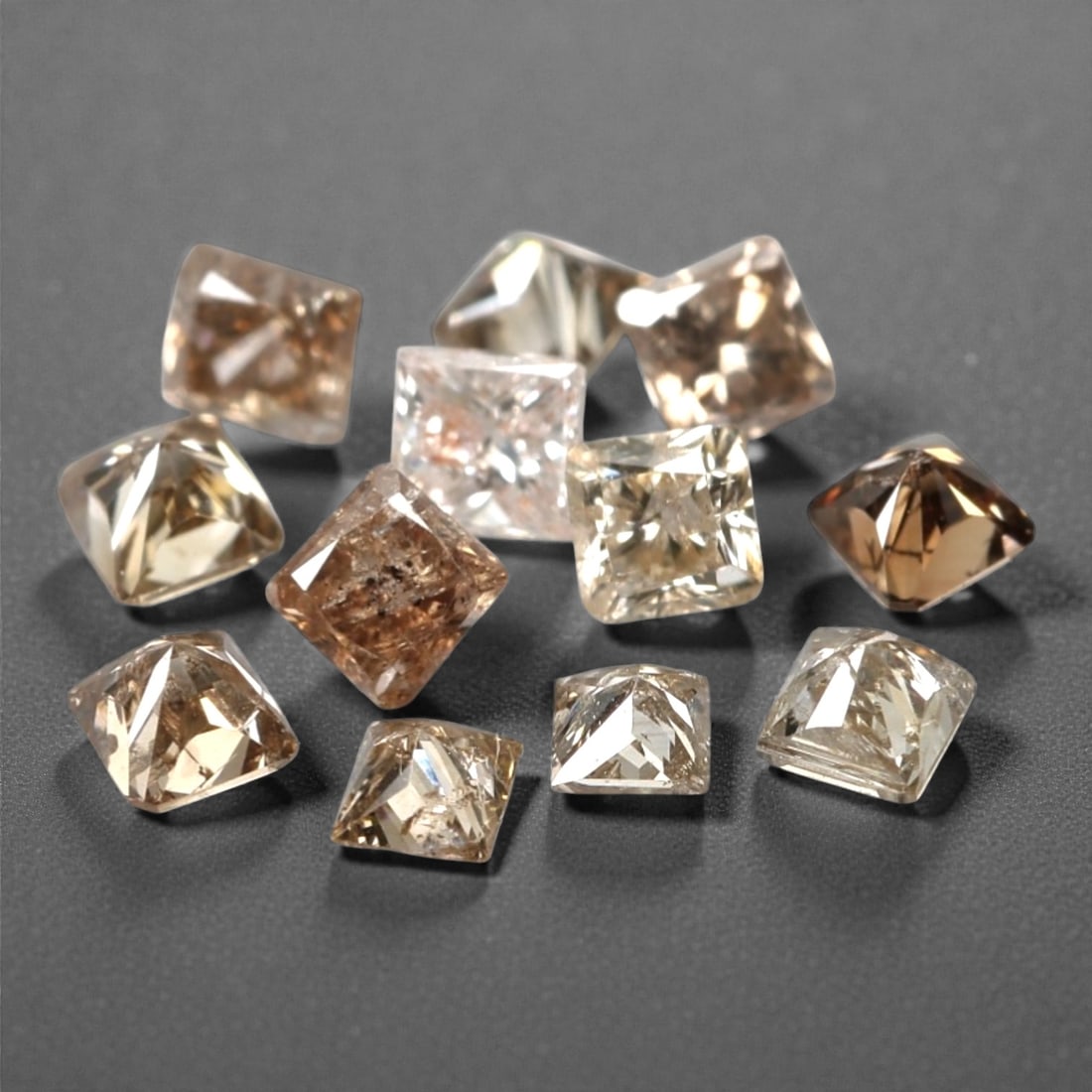 0.57ct 12 Pieces Champagne Diamond Parcel - Princess Cut, 215A: This elegant parcel of 12 loose champagne diamond gems captivates with a warm, honeyed hue that evokes the richness of aged champagne and the glow of liquid sunlight. Each stone is cut in a well-propo