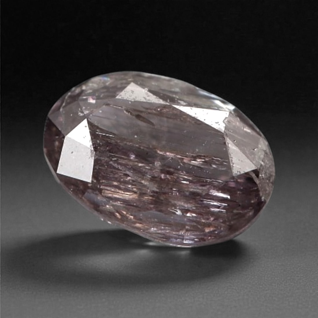 0.14 Carats Purplish Pink Diamond - Natural Argyle Mine, Australia, 112A: This singular purplish pink diamond from the Argyle mine is a rare and captivating gem, showcasing the distinctive, velvety hue that has made Australian pink diamonds among the most coveted in the wor