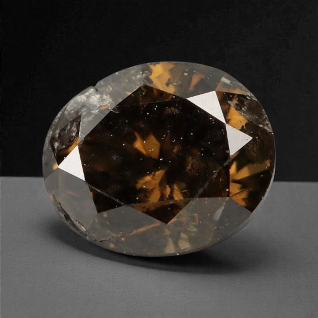 0.34 Carats Cognac Fancy Diamond - Natural African Stone, 4.6x3.7mm, 40A: This singular cognac fancy diamond radiates with a warm, ambered glow, evoking the rich tones of aged brandy and sunlit honey. Precision-cut in a classic brilliant shape, its facets catch light to rev