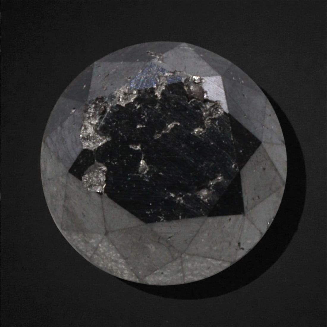 2.03 Carats Black Diamond - Round Brilliant Cut, 284A: This substantial black diamond captivates with a deep, opaque black hue that evokes the intensity of polished obsidian and the mystery of a midnight sky. Cut in a well-proportioned round brilliant sha