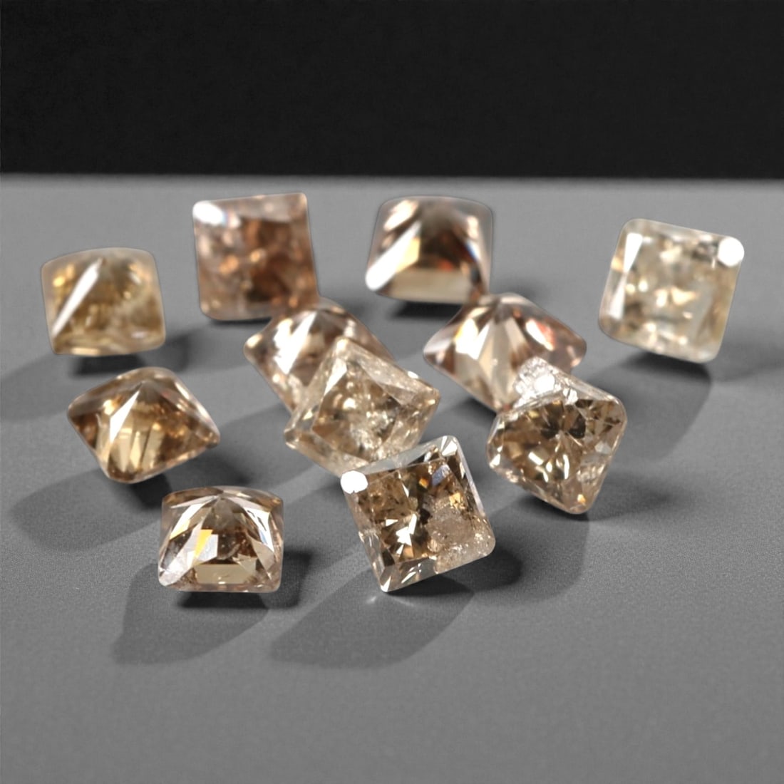 0.51ct 11 Pieces Champagne Diamond Parcel - Princess Cut, 216A: This elegant parcel of 11 loose champagne diamond gems captivates with a warm, honeyed hue that evokes the richness of aged champagne and the glow of liquid sunlight. Each stone is cut in a well-propo