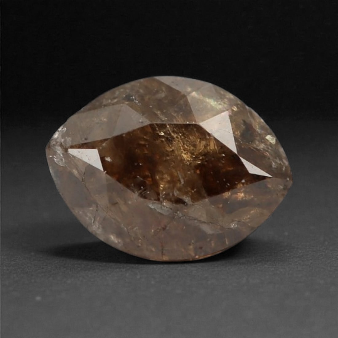 0.25 Carats Cognac Fancy Diamond - Natural African Stone, 4.4x3.2mm, 39A: This singular cognac fancy diamond radiates with a warm, ambered glow, evoking the rich tones of aged brandy and sunlit honey. Precision-cut in a classic brilliant shape, its facets catch light to rev