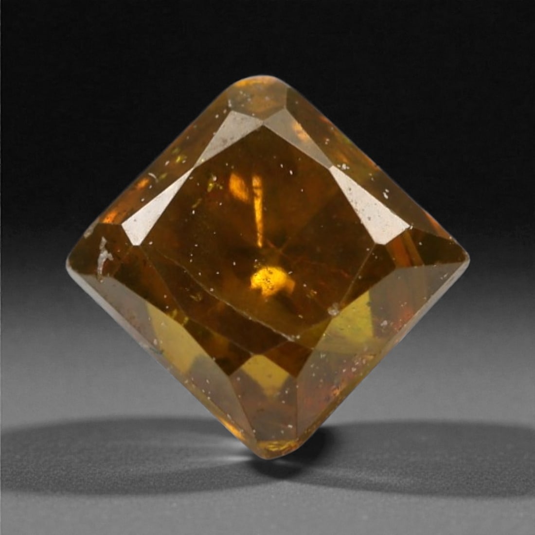 0.42 Carats Orangy Red Fancy Diamond - Princess Cut, 185A: This rare fancy orangy red diamond captivates with a vivid, warm hue that evokes the intensity of a glowing ember and the richness of a sunset. Cut in a well-proportioned princess shape, the stone's f