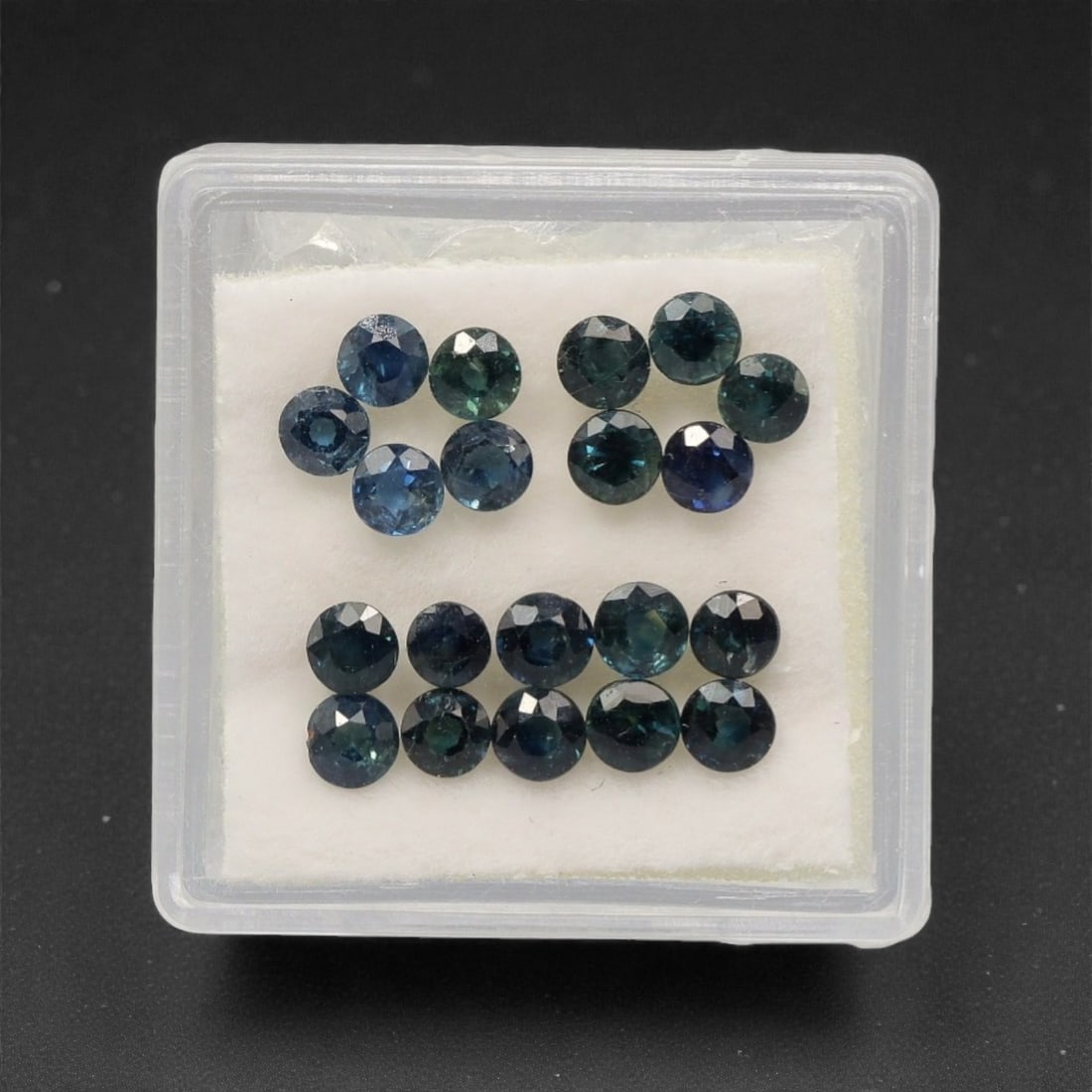 4.26 Carats Teal-Blue Parti Sapphire Parcel - Natural Australian Stones, 73XK: This curated parcel of parti sapphires presents a striking blend of deep teal, forest green, and vivid blue tones, with subtle color zoning that shifts dynamically across each round, faceted stone. Li
